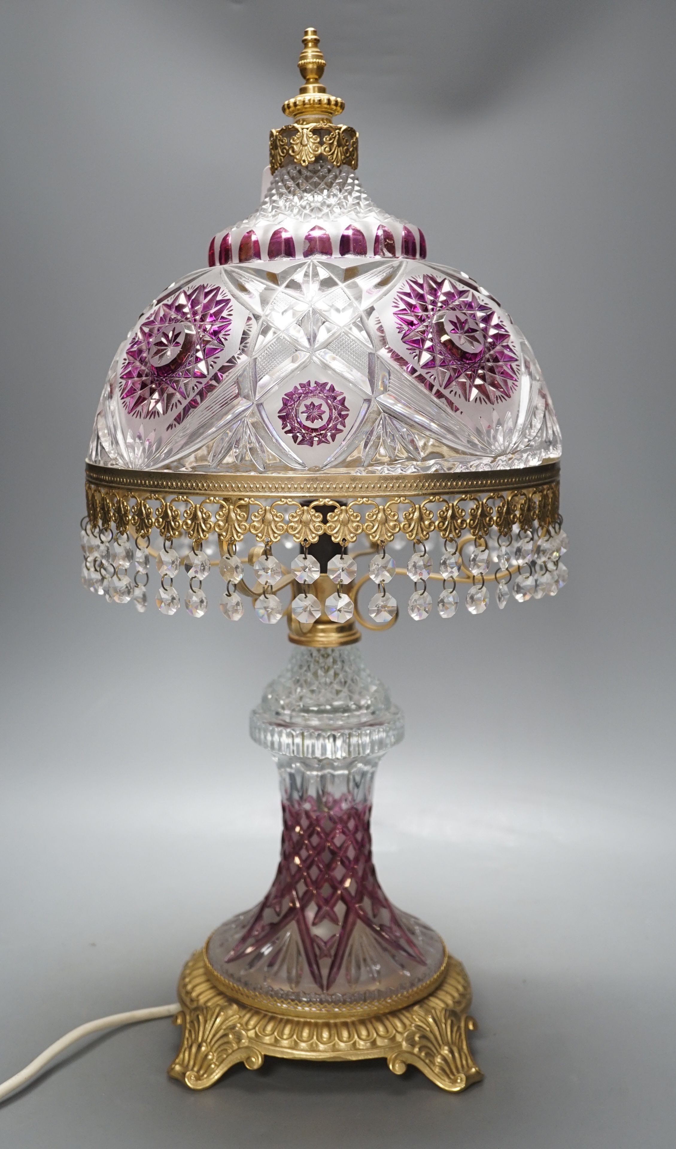 An Italian cut clear, frosted and amethyst glass table lamp with gilt metal mounts-57 cms high.